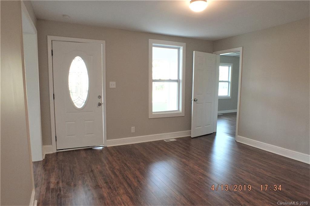 288 South Potter Road Lancaster, SC 29720 - Photo 3 of 24 an empty room with wooden floor and windows