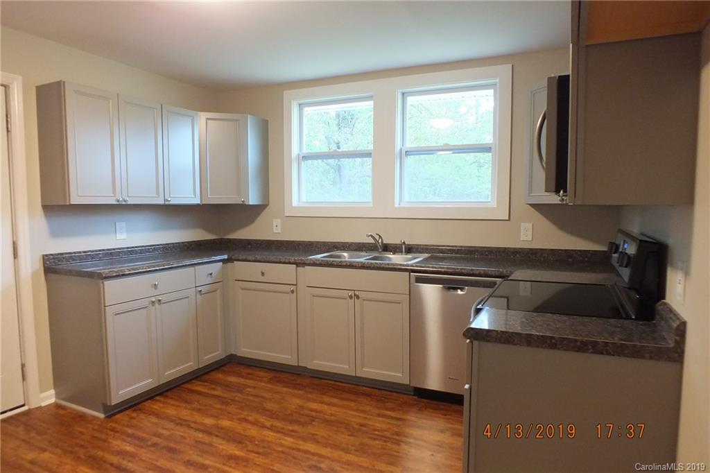 288 South Potter Road Lancaster, SC 29720 - Photo 5 of 24 a kitchen with appliances cabinets and a sink