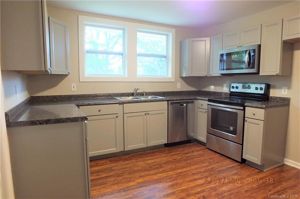 288 South Potter Road Lancaster, SC 29720 - Photo 6 of 24 a kitchen with stainless steel appliances granite countertop a stove a sink and a microwave
