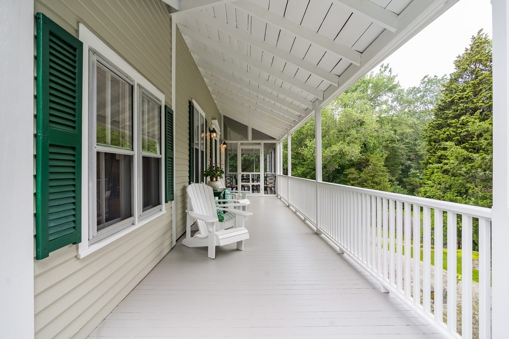 76 Gannett Road Scituate, MA 02066 - Photo 11 of 41 a view of a patio with a table chairs and a backyard