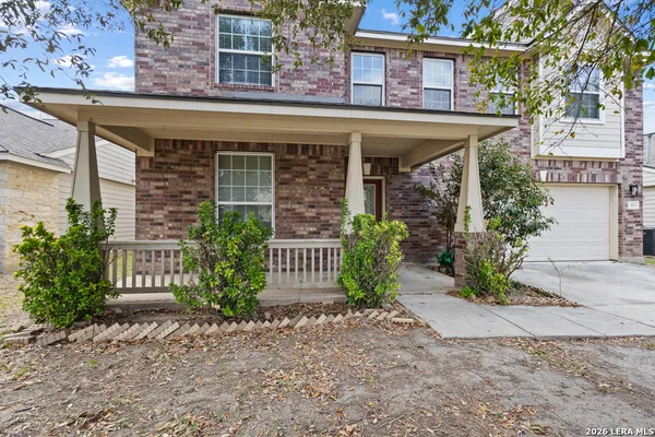 front view of a house with a garden