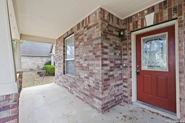 a view of a hallway with brick walls