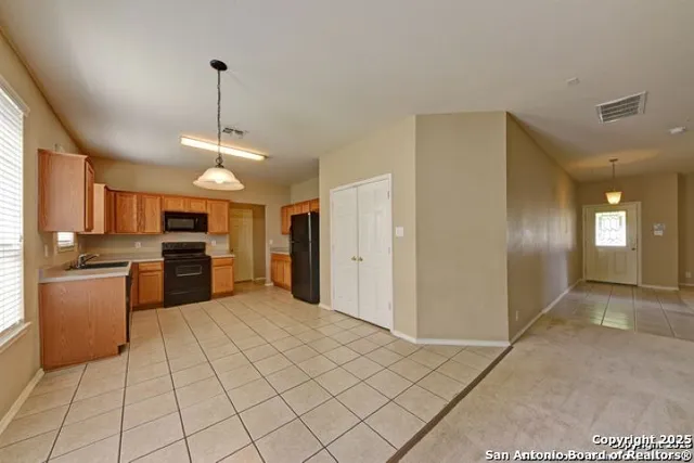 a view of a kitchen with a sink and dishwasher