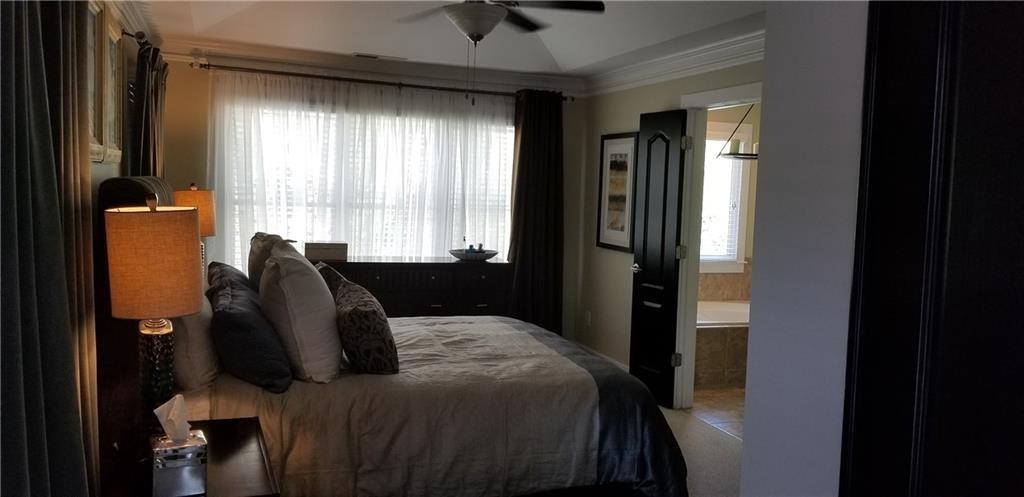 2436 Dresden Parc Circle Atlanta, GA 30345 - Photo 8 of 17 a bed room with a bed and a window