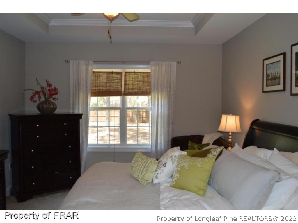 103 Sandy Springs Road Aberdeen, NC 28315 - Photo 12 of 25 a bedroom with a bed and window