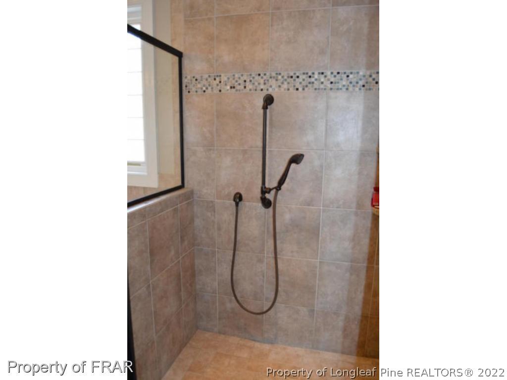 103 Sandy Springs Road Aberdeen, NC 28315 - Photo 15 of 25 a bathroom with a shower
