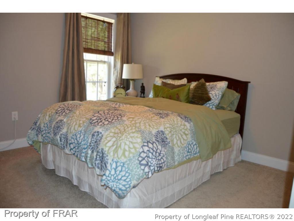 103 Sandy Springs Road Aberdeen, NC 28315 - Photo 17 of 25 a bedroom with a bed and window