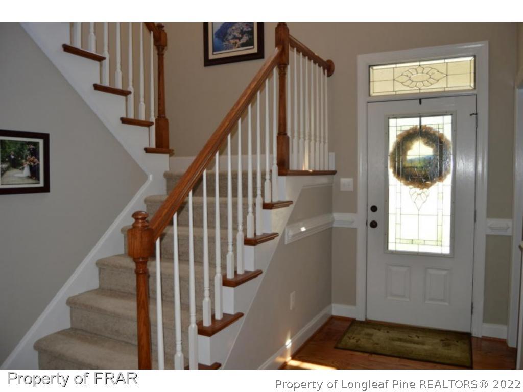 103 Sandy Springs Road Aberdeen, NC 28315 - Photo 21 of 25 a view of entryway and hall with wooden floor