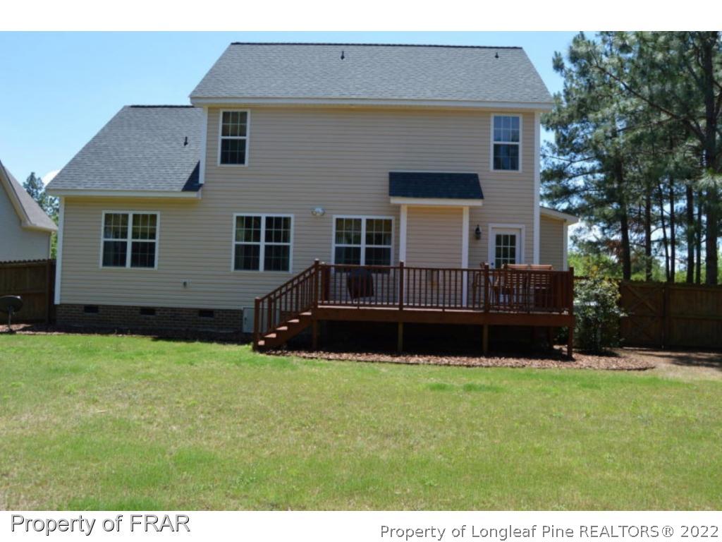103 Sandy Springs Road Aberdeen, NC 28315 - Photo 24 of 25 a house that has a big yard in front of it