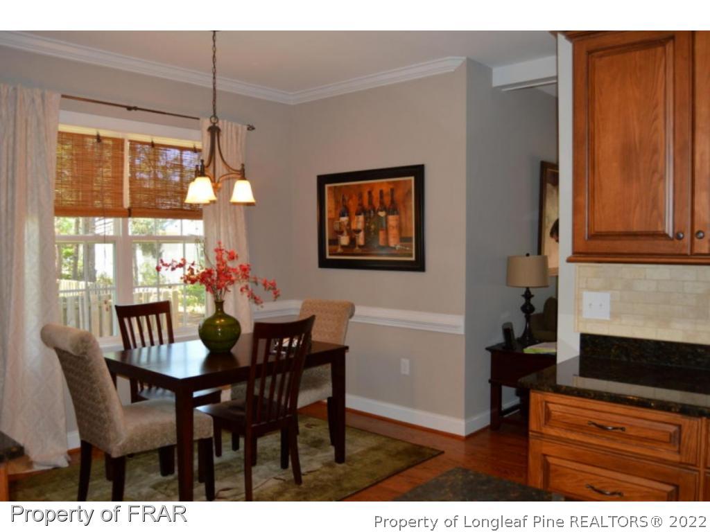 103 Sandy Springs Road Aberdeen, NC 28315 - Photo 8 of 25 a dining room with furniture and window