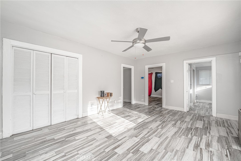 430 Rose Avenue Long Beach, CA 90802 - Photo 11 of 20 a view of empty room with wooden floor and fan