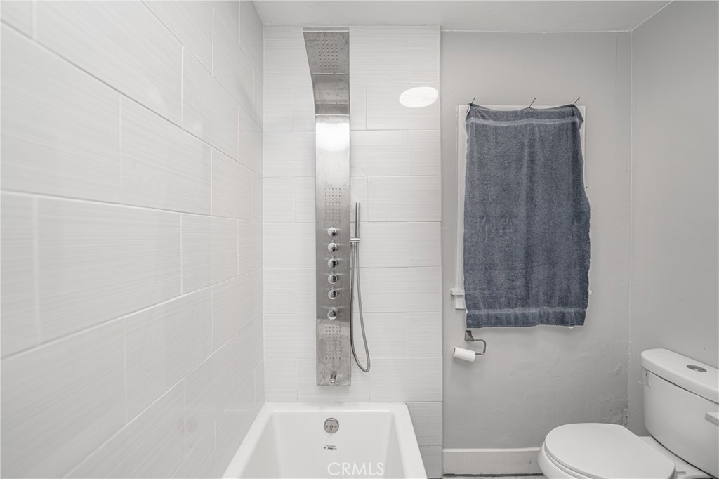 430 Rose Avenue Long Beach, CA 90802 - Photo 15 of 20 a bathroom with a toilet and shower