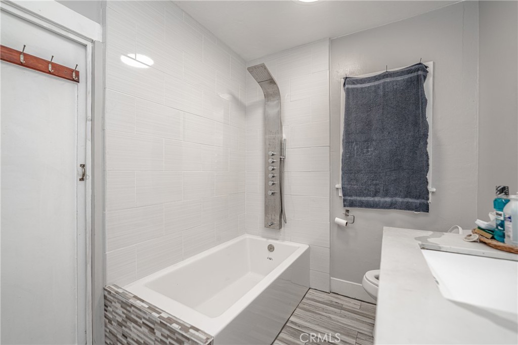 430 Rose Avenue Long Beach, CA 90802 - Photo 19 of 20 a bathroom with a tub and a shower