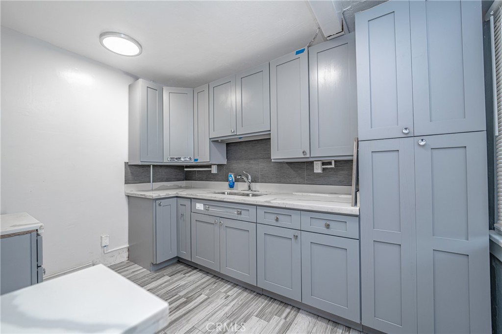 430 Rose Avenue Long Beach, CA 90802 - Photo 8 of 20 a spacious bathroom with a granite countertop sink and a vanity