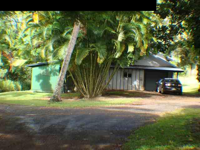 323 Hahana Road Haiku, HI 96708 - Photo 2 of 12 a view of a house with backyard and a car parked