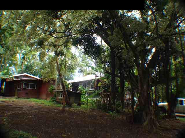 323 Hahana Road Haiku, HI 96708 - Photo 7 of 12 a backyard of a house with table and chairs