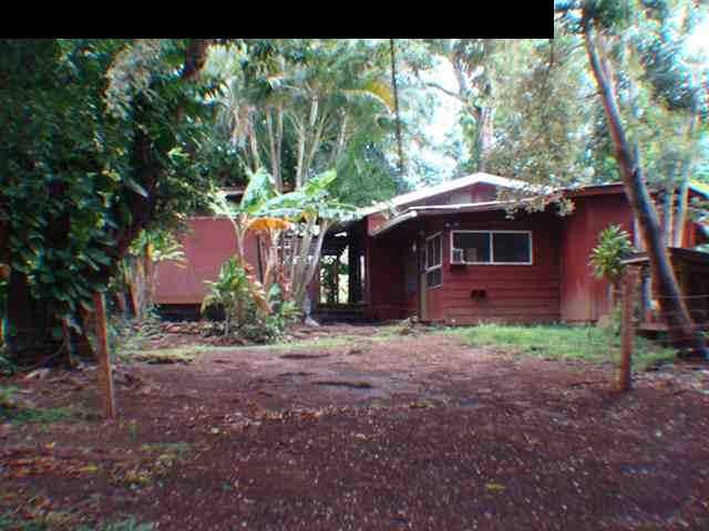 323 Hahana Road Haiku, HI 96708 - Photo 8 of 12 a backyard of a house with table and chairs