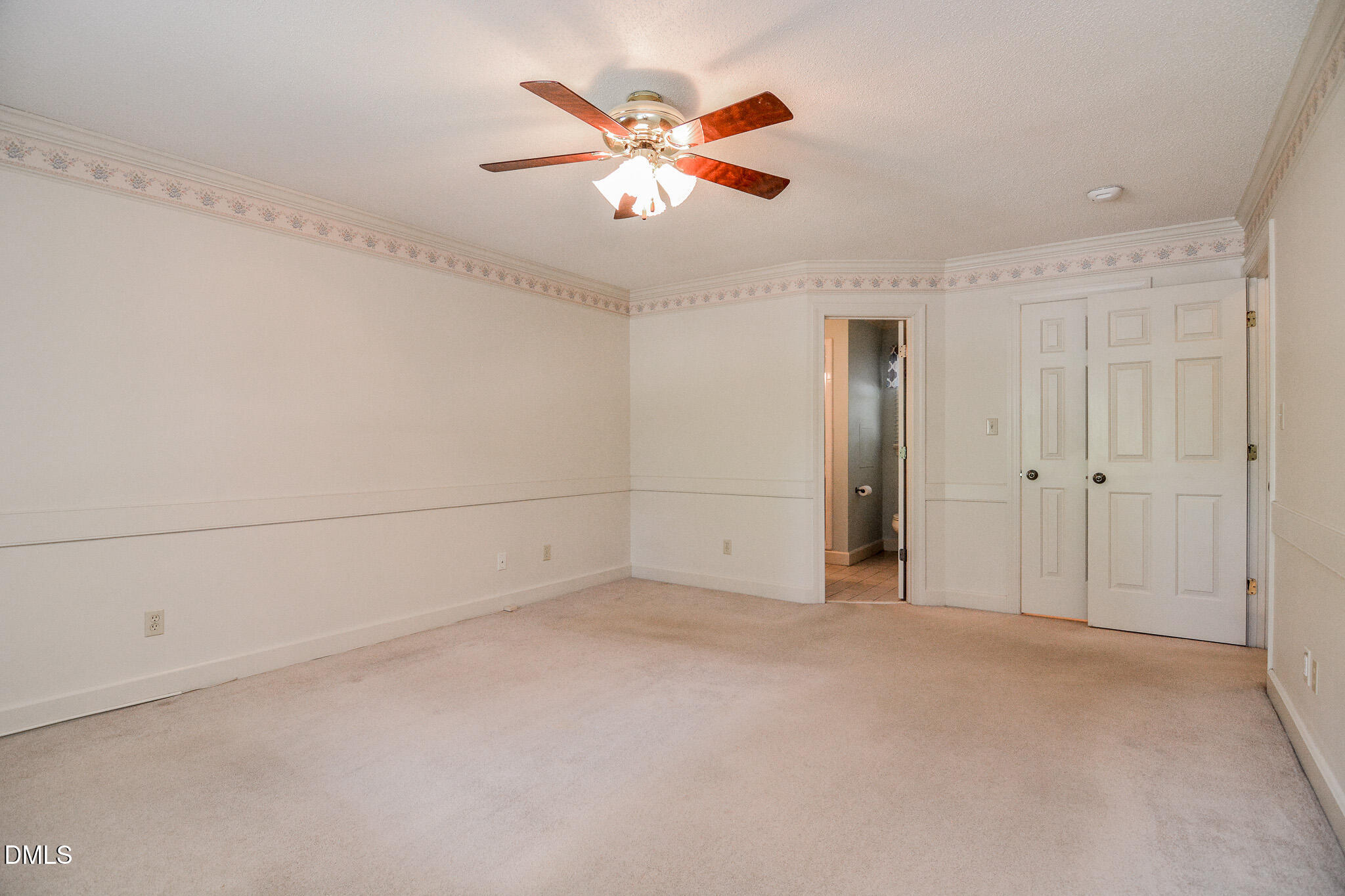 1215 Cambridge Road Northwest Wilson, NC 27896 - Photo 41 of 54 an empty room with closet and fan