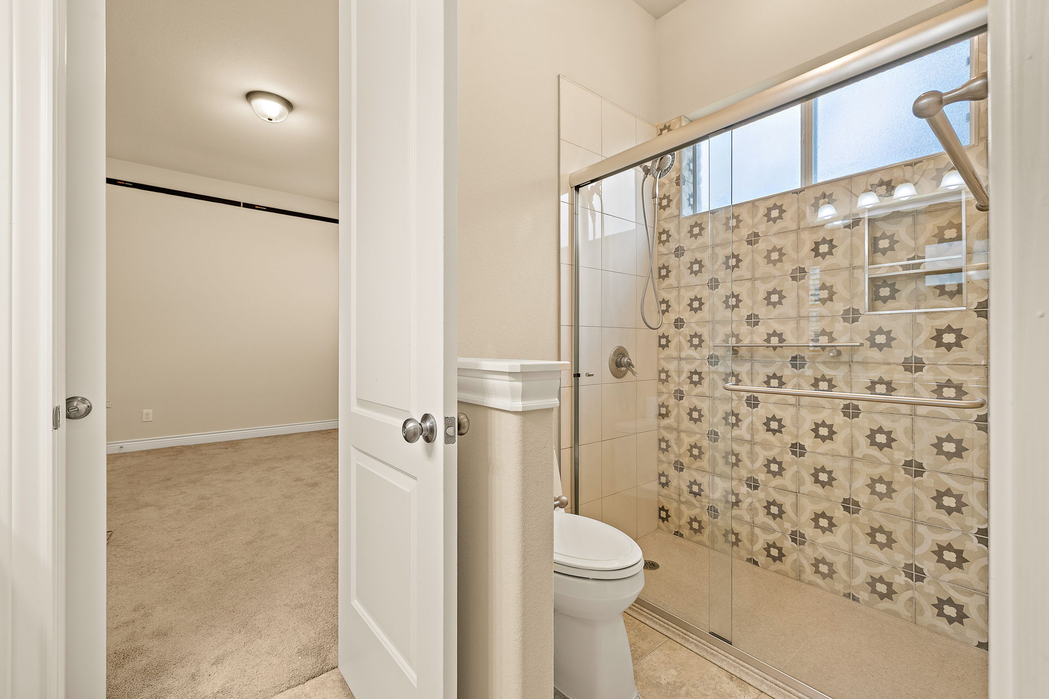 174 Estrella Crossing Georgetown, TX 78628 - Photo 23 of 38 Bathroom featuring carpet and a stall shower