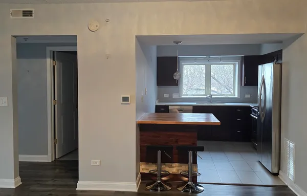 a view of kitchen with sink and window