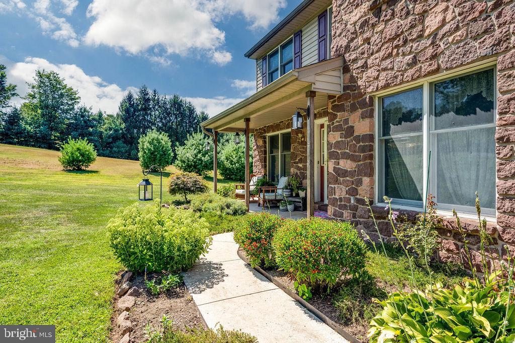 881 Zion Road Mohnton, PA 19540 - Photo 45 of 64 Charming stone home with lush greenery.