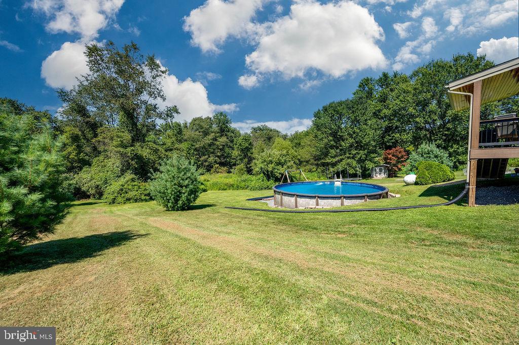 881 Zion Road Mohnton, PA 19540 - Photo 50 of 64 Serene backyard oasis with a pool retreat.