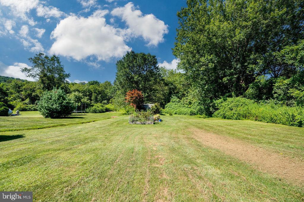 881 Zion Road Mohnton, PA 19540 - Photo 57 of 64 Lush green expanse under a bright sky.