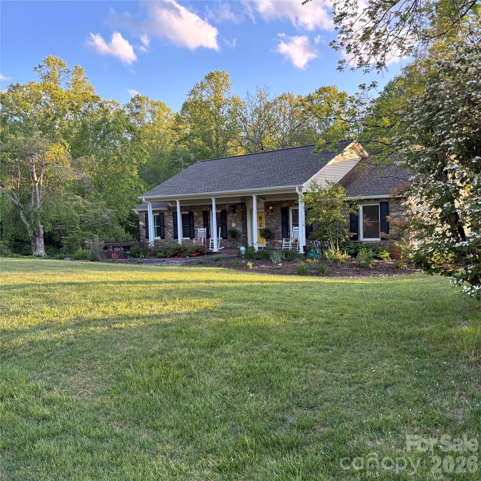 27 Sun Valley Court Alexander, NC 28701 - Photo 1 of 2 a house view with swimming pool and garden