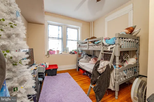 a bed room with furniture and a window