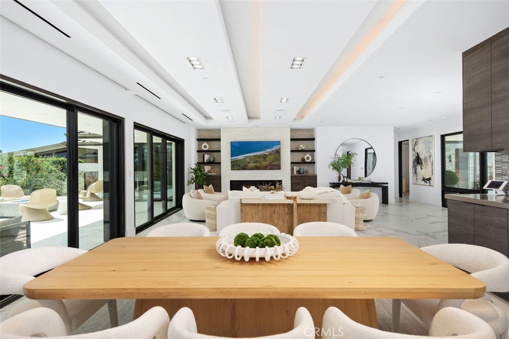 67 Monarch Bay Drive Dana Point, CA 92629 - Photo 14 of 44 a view of a dining room with furniture large windows and wooden floor