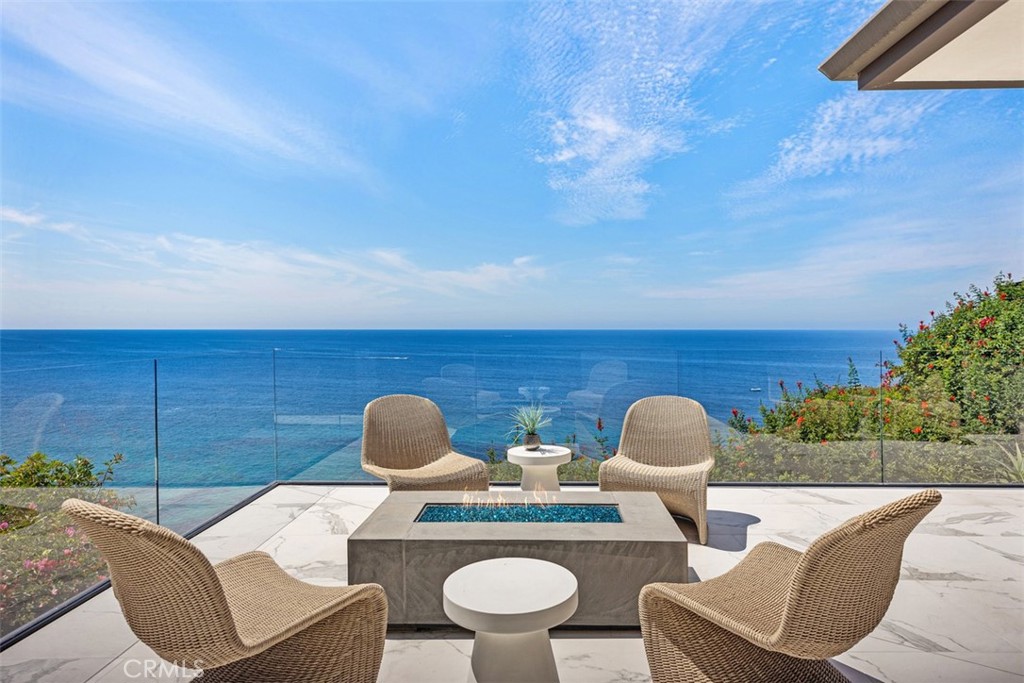 67 Monarch Bay Drive Dana Point, CA 92629 - Photo 2 of 44 a living room with furniture and a fireplace