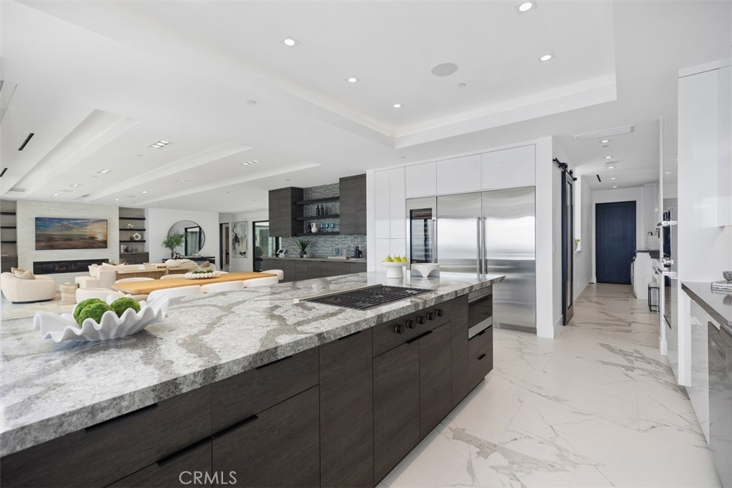 67 Monarch Bay Drive Dana Point, CA 92629 - Photo 22 of 44 a large kitchen with stainless steel appliances lots of counter top space and center island