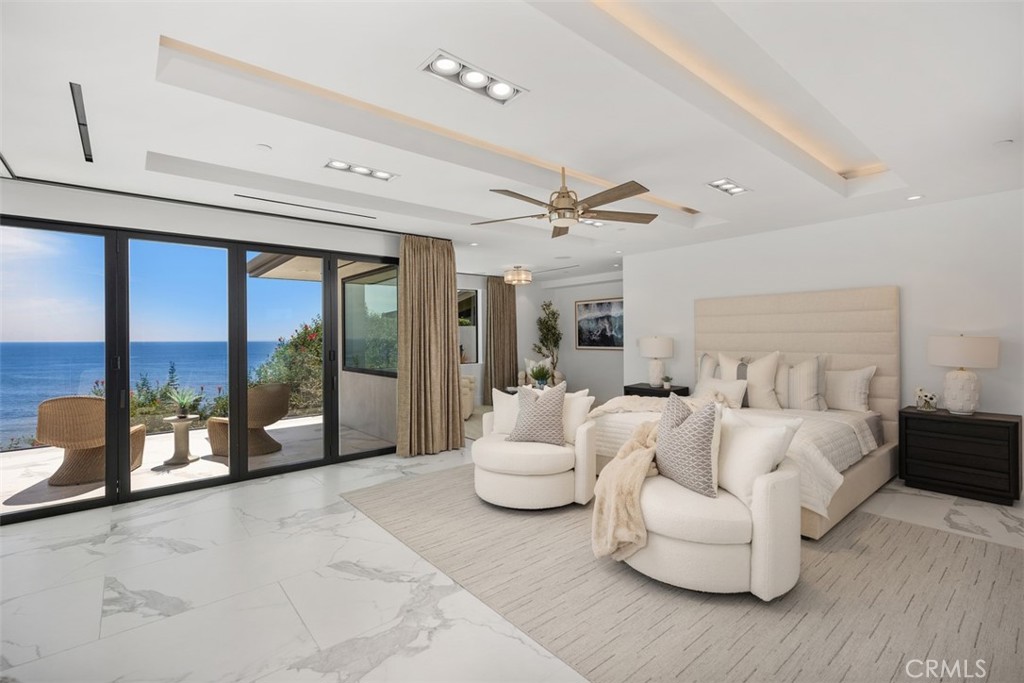 67 Monarch Bay Drive Dana Point, CA 92629 - Photo 24 of 44 a living room with furniture and a floor to ceiling window