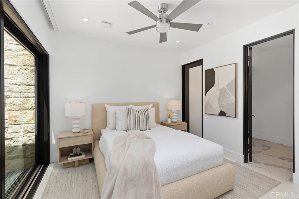 67 Monarch Bay Drive Dana Point, CA 92629 - Photo 30 of 44 a bedroom with a bed and a large window