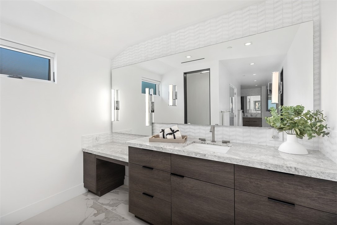 67 Monarch Bay Drive Dana Point, CA 92629 - Photo 32 of 44 a bathroom with a sink and a mirror