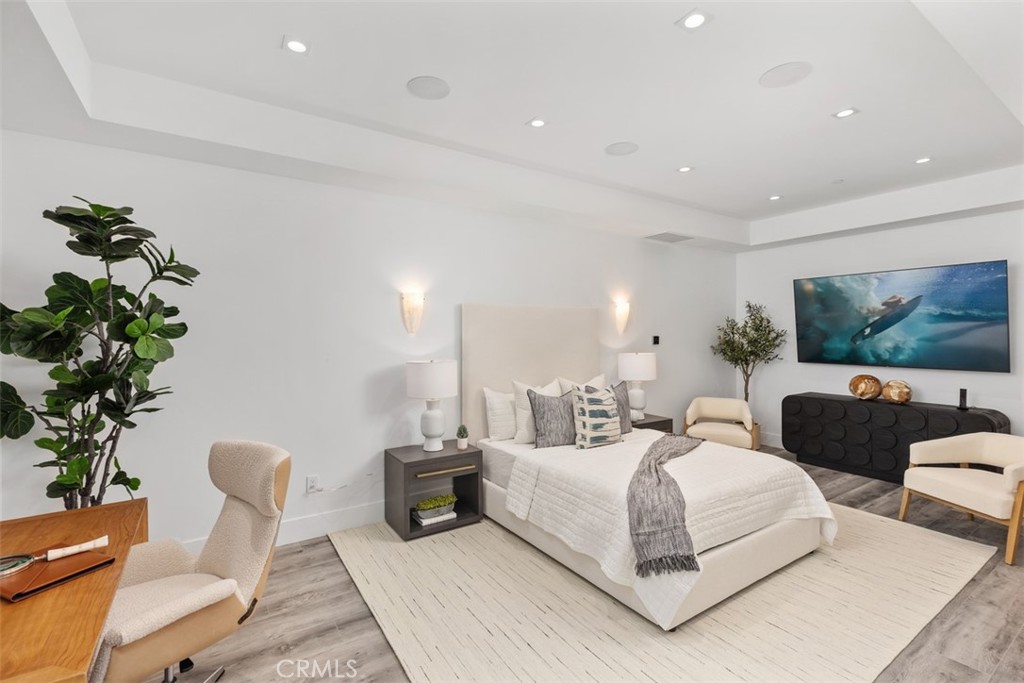 67 Monarch Bay Drive Dana Point, CA 92629 - Photo 37 of 44 a bedroom with furniture and a potted plant