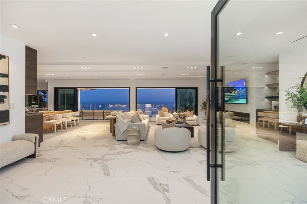67 Monarch Bay Drive Dana Point, CA 92629 - Photo 8 of 44 a living room with furniture and a large window