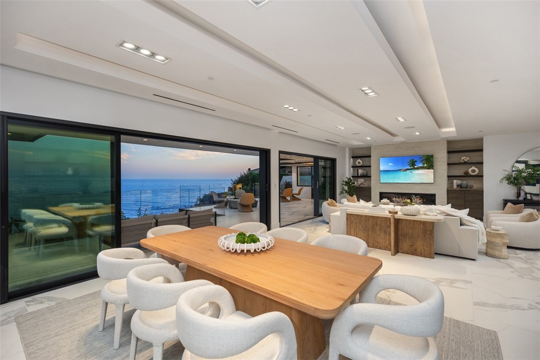67 Monarch Bay Drive Dana Point, CA 92629 - Photo 10 of 44 a dining room with furniture a garden and a kitchen view