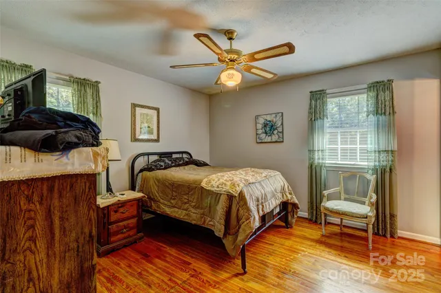 a bedroom with a bed and a view of bedroom