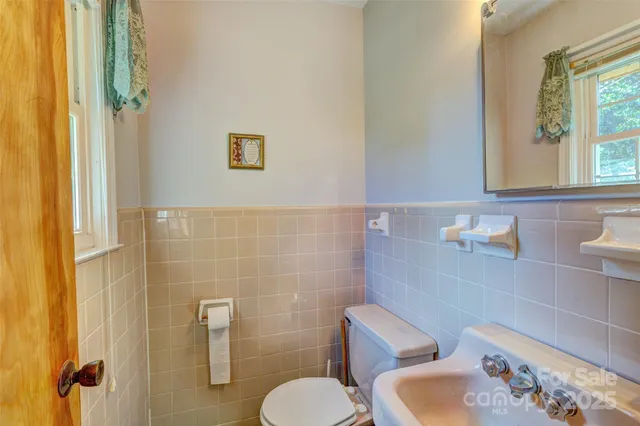 a bathroom with a toilet and a sink