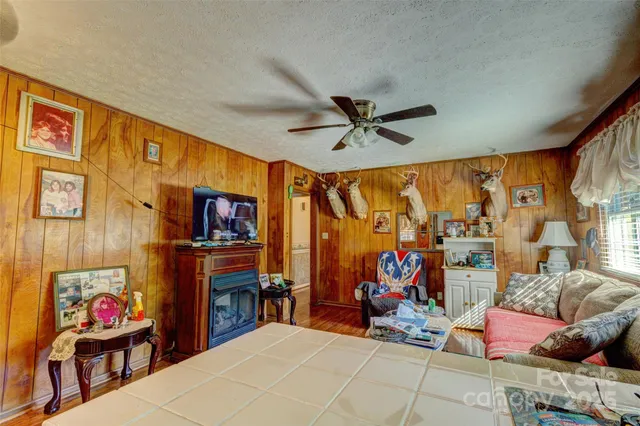 a living room with lots of furniture and a flat screen tv