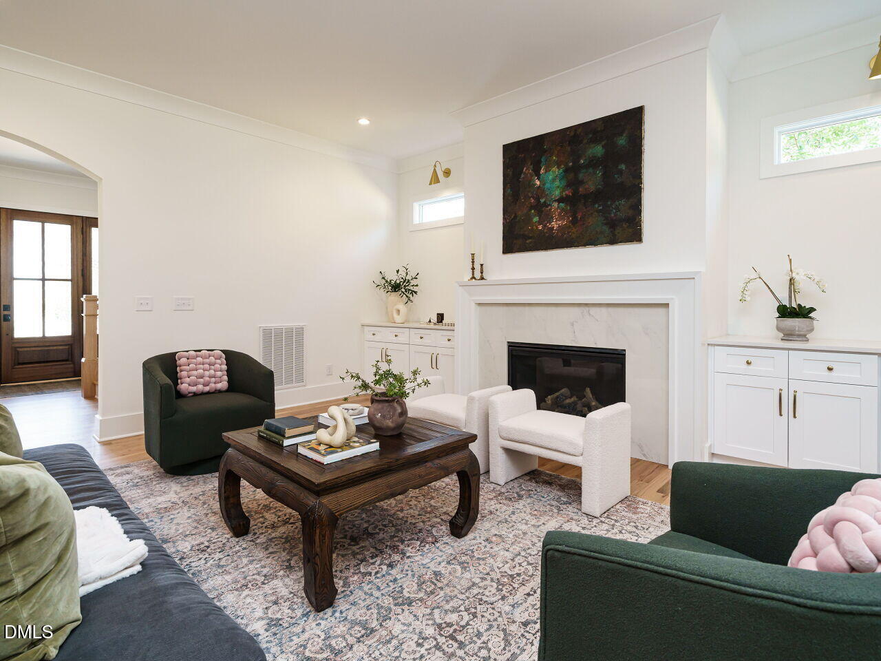 627 Georgetown Road Raleigh, NC 27608 - Photo 13 of 44 a living room with furniture a flat screen tv and a fireplace
