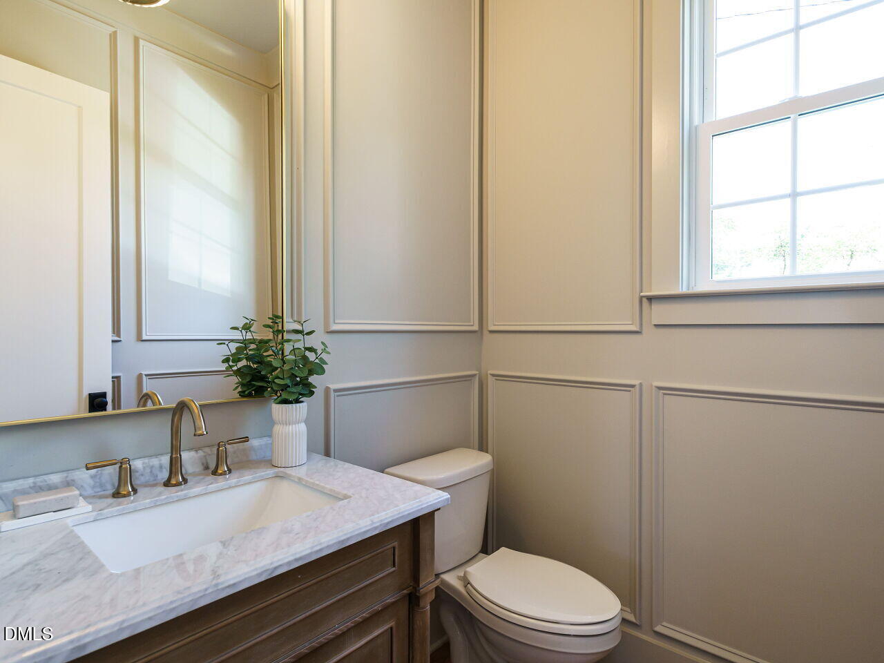 627 Georgetown Road Raleigh, NC 27608 - Photo 17 of 44 a bathroom with a granite countertop sink vanity mirror and toilet