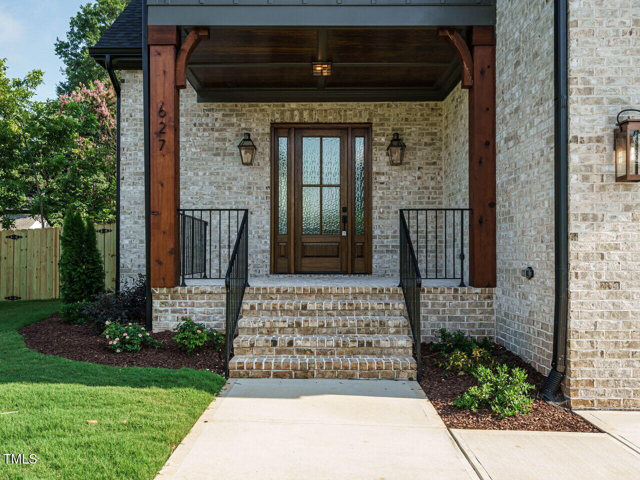 627 Georgetown Road Raleigh, NC 27608 - Photo 2 of 44 a front view of a house with a garden