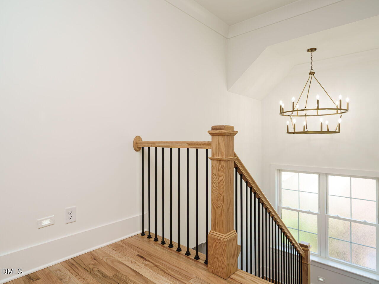 627 Georgetown Road Raleigh, NC 27608 - Photo 24 of 44 a view of a hallway with wooden floor and stairs