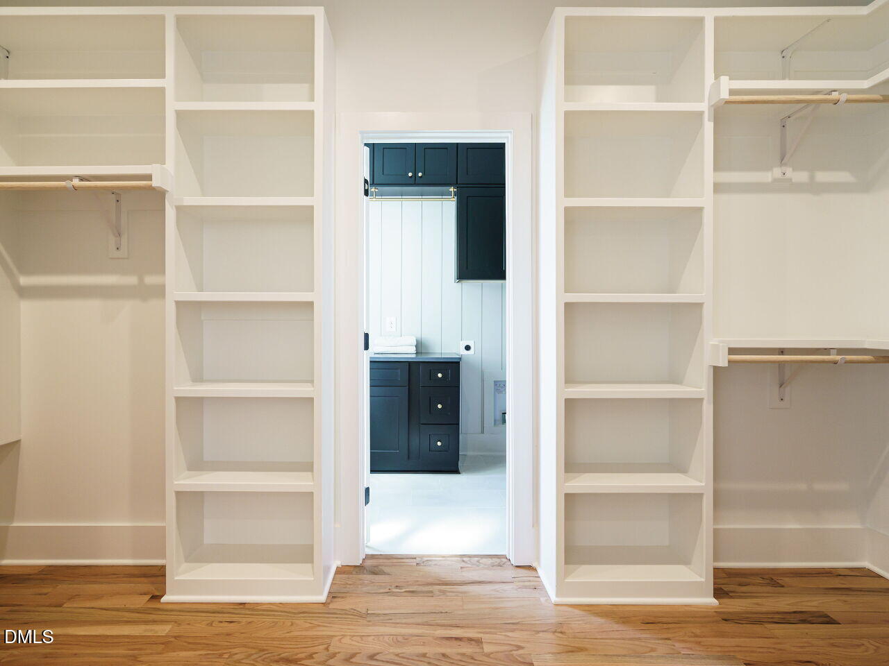 627 Georgetown Road Raleigh, NC 27608 - Photo 31 of 44 a view of walk in closet with empty racks