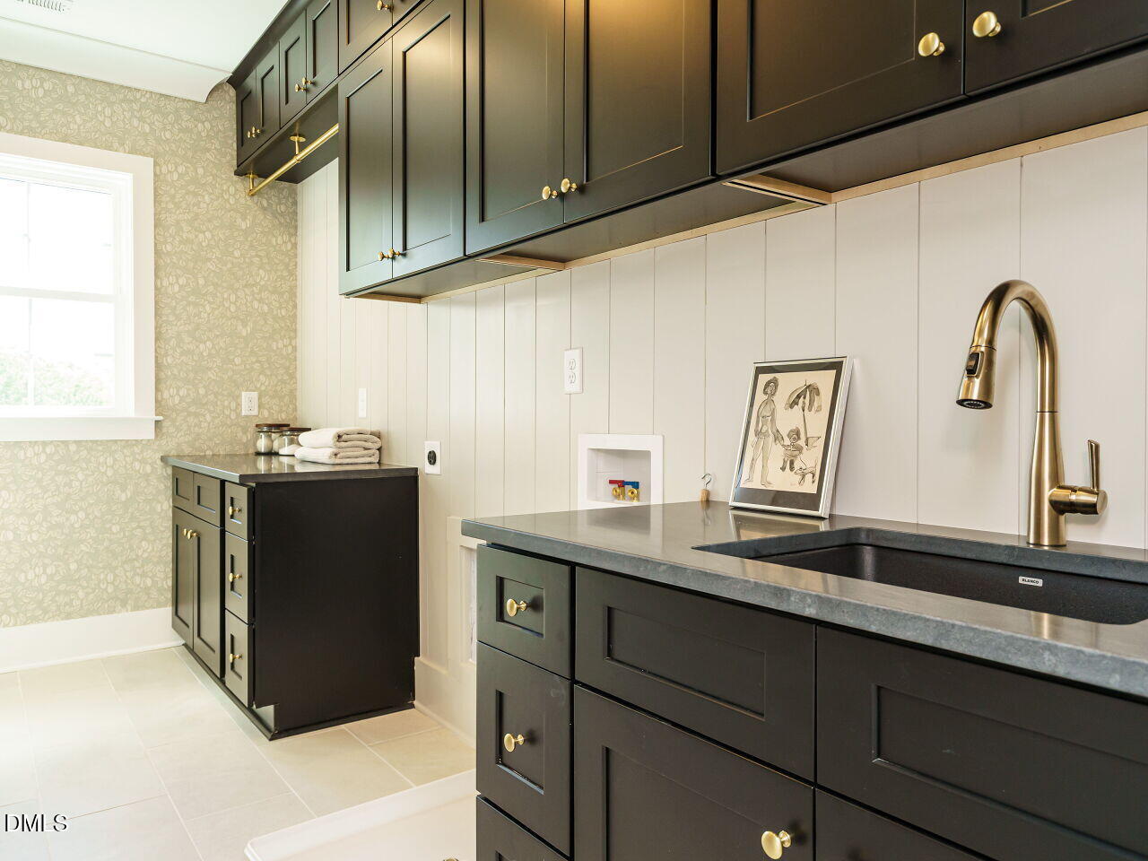627 Georgetown Road Raleigh, NC 27608 - Photo 33 of 44 a kitchen with sink and cabinets