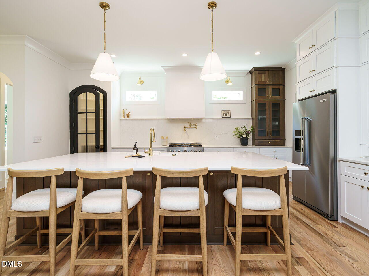 627 Georgetown Road Raleigh, NC 27608 - Photo 6 of 44 a dining room with stainless steel appliances granite countertop a dining table chairs and refrigerator
