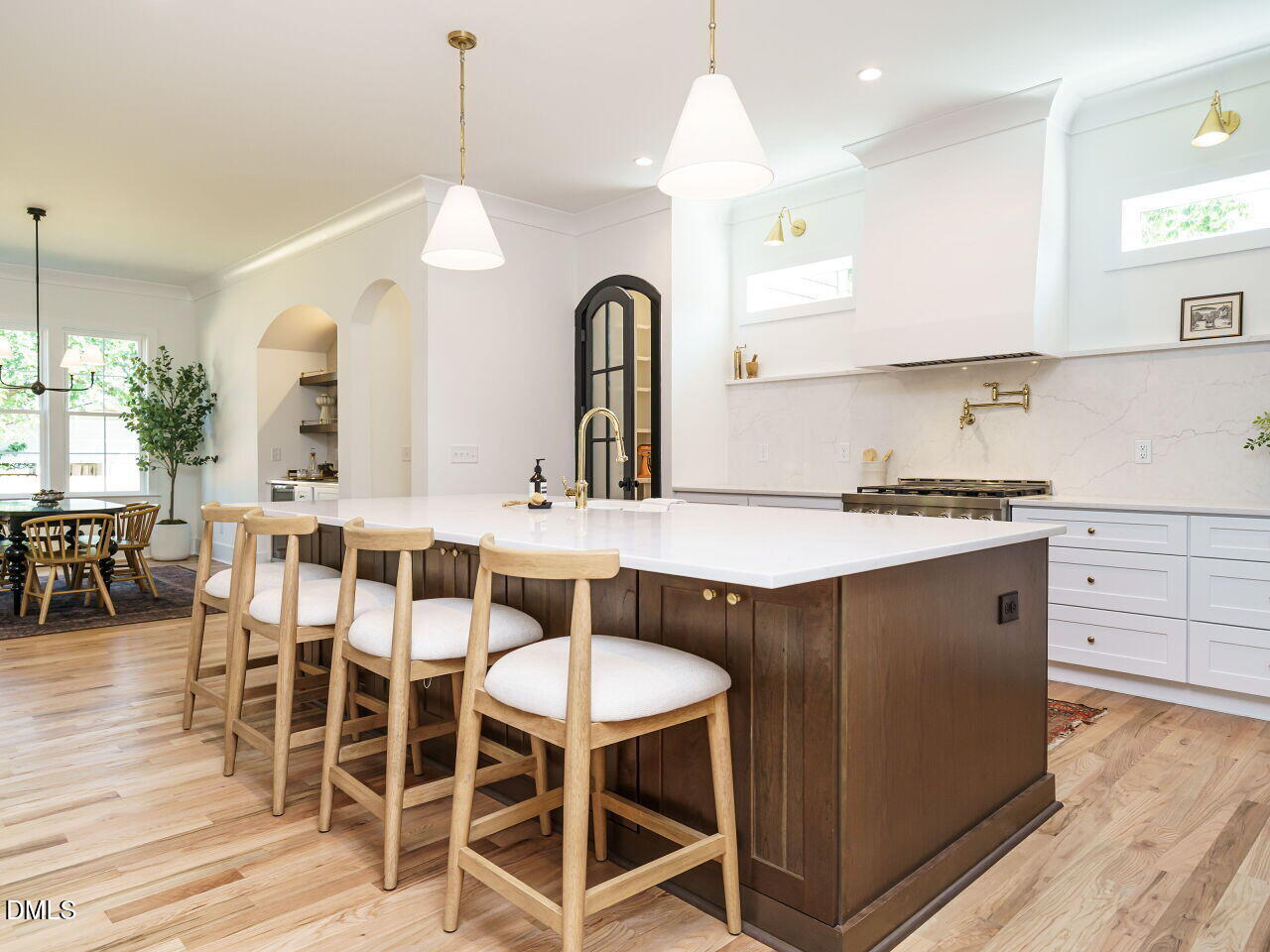 627 Georgetown Road Raleigh, NC 27608 - Photo 7 of 44 a kitchen with granite countertop a table chairs stove and wooden floor