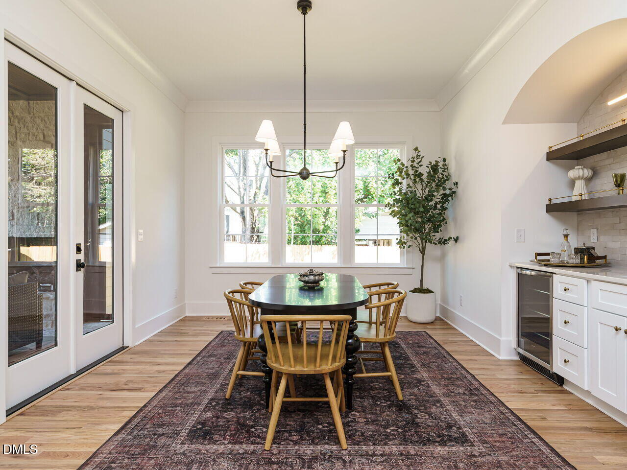 627 Georgetown Road Raleigh, NC 27608 - Photo 9 of 44 a dining room with furniture window and wooden floor